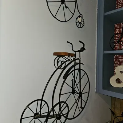 Sale Photo Thumbnail #32: Set of black metal wire penny-farthing bicycle wall art sculptures with wooden seats.