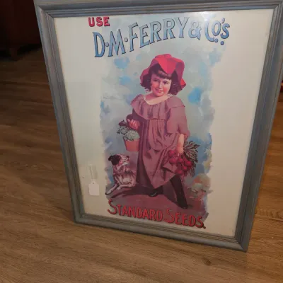 Sale Photo Thumbnail #35: Framed vintage-style D.M. Ferry & Co's Standard Seeds advertising print featuring a young girl holding produce next to a dog.