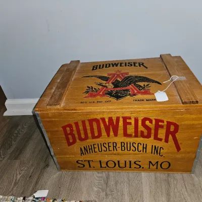 Sale Photo Thumbnail #73: Vintage-style Budweiser wooden crate with hinged lid, featuring classic Anheuser-Busch graphics and logo printed on the front and top.