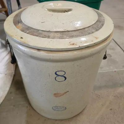 Sale Photo Thumbnail #137: Vintage Red Wing Union Stoneware 8-gallon stoneware crock with a matching lid and wire bale handles.