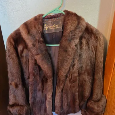 Sale Photo Thumbnail #320: Vintage Wurzburg of Grand Rapids brown fur coat featuring cuffed sleeves and a wide collar.