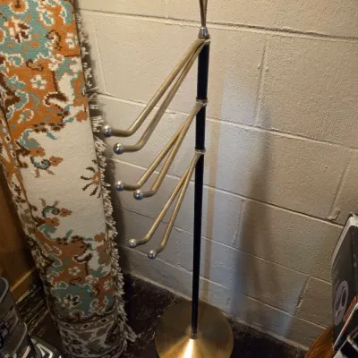 Sale Photo Thumbnail #158: Mid-century modern freestanding brass and black metal towel or quilt rack with adjustable swinging arms.