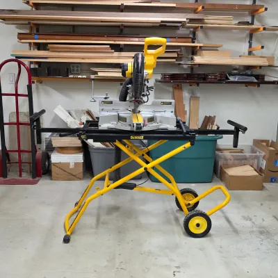 Sale Photo Thumbnail #4: DeWalt sliding compound miter saw with rolling miter saw stand.