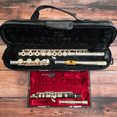 Sale Photo Thumbnail #15: Yamaha sterling silver open-hole flute and Yamaha piccolo, each with a fitted case.