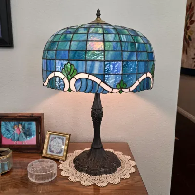 Sale Photo Thumbnail #21: Tiffany-style leaded stained-glass table lamp with blue and green shade.