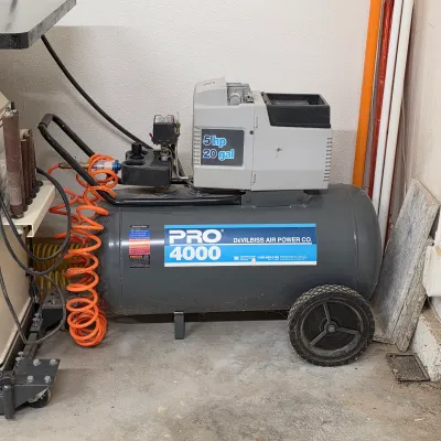 Sale Photo Thumbnail #75: DeVilbiss Pro 4000 portable air compressor with wheeled tank.
