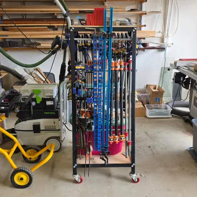 Sale Photo Thumbnail #94: Woodworking clamp collection with bar clamps and mobile clamp storage rack.