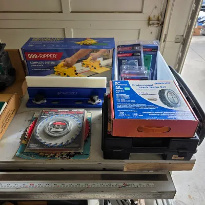 Sale Photo Thumbnail #254: GRR-RIPPER woodworking push-block system with saw blades and shop accessories.