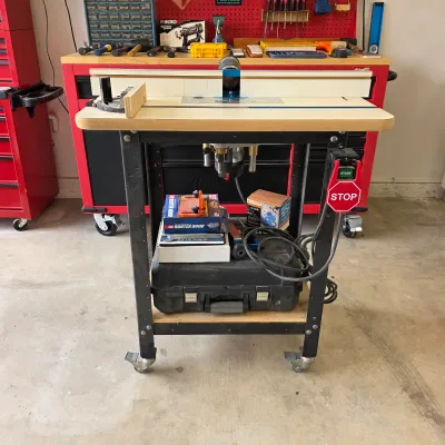 Sale Photo Thumbnail #90: Router table with Rockler router lift, adjustable fence and mobile stand.