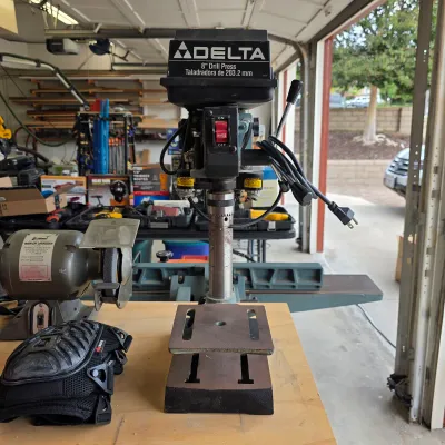 Sale Photo Thumbnail #92: Delta benchtop drill press with adjustable worktable.