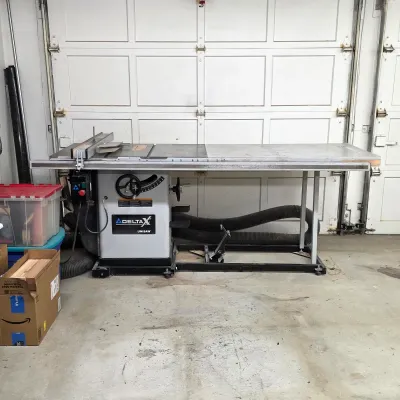 Sale Photo Thumbnail #6: Delta Unisaw cabinet table saw with extension table and rip fence.