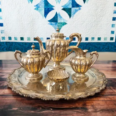 Sale Photo Thumbnail #7: Sterling silver coffee/tea service with tray, creamer, covered sugar and shell bowl; acquired in Taxco, Mexico, in the late 1940s according to the family letter.