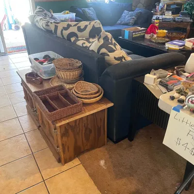Sale Photo Thumbnail #56: Collection of woven baskets resting on a wooden side cabinet, featuring a rectangular organizer and nested round baskets in a living room setup.