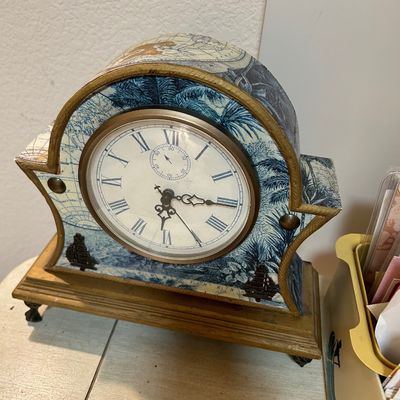 Sale Photo Thumbnail #64: Vintage-style mantel clock decorated with nautical map decoupage and blue toile palm tree graphics, featuring Roman numerals.