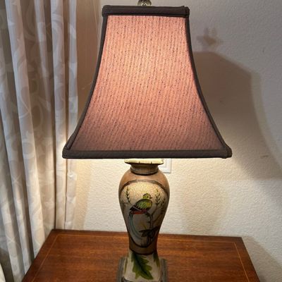 Sale Photo Thumbnail #12: Traditional table lamp featuring an urn-shaped body with a hand-painted quetzal bird medallion and crackle glaze finish, topped with a bell-style fabric shade.