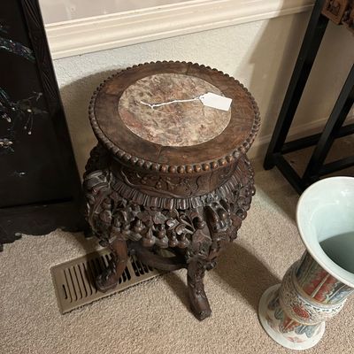 Sale Photo Thumbnail #96: Ornately carved Chinese dark wood plant stand featuring a round marble inset top and beaded trim.