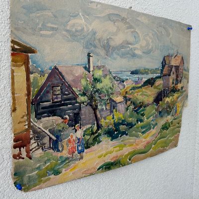 Sale Photo Thumbnail #170: Unframed vintage watercolor landscape painting depicting a coastal village scene with houses and figures, pinned to a textured wall.