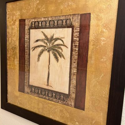 Sale Photo Thumbnail #5: Framed mixed-media wall art featuring a central palm tree motif surrounded by textured gold foil and damask pattern borders in a dark wood frame.
