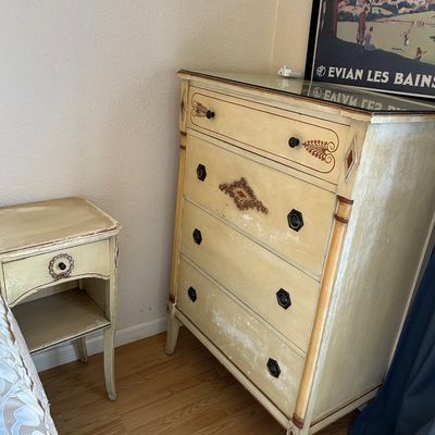 Sale Photo Thumbnail #185: Vintage French Provincial style painted four-drawer dresser and matching nightstand with distressed cream finish and decorative hardware.