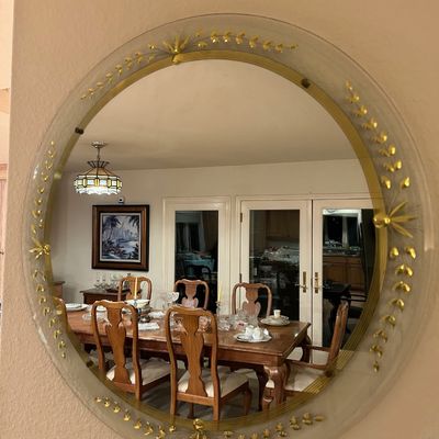 Sale Photo Thumbnail #92: Round mid-century wall mirror with a frosted glass border decorated with gold leaf motifs.