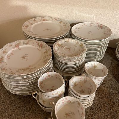 Sale Photo Thumbnail #37: Large vintage Haviland Limoges porcelain dinnerware service featuring delicate pink rose garlands, gold trim, and scalloped edges.