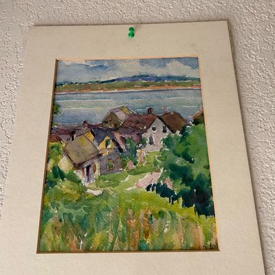Sale Photo Thumbnail #141: Original matted watercolor painting depicting a coastal village landscape, signed by the artist in the lower right corner.