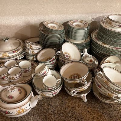 Sale Photo Thumbnail #39: Large vintage fine china dinnerware service featuring a floral motif with green trim, including plates, teacups, saucers, bowls, serveware, and a teapot.