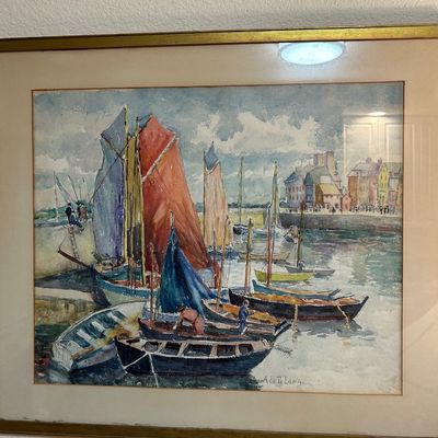 Sale Photo Thumbnail #54: Framed watercolor painting depicting sailboats in a harbor, signed by artist Ada D. Lange in the lower right corner, presented in a simple gold-tone frame.