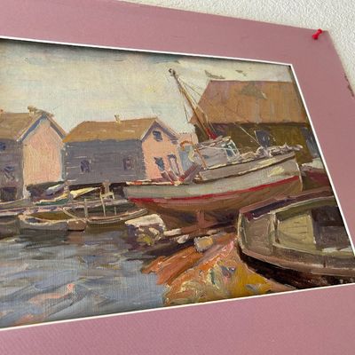 Sale Photo Thumbnail #147: Impressionist oil painting on canvas depicting boats docked near harbor buildings, presented in a pink mat board.