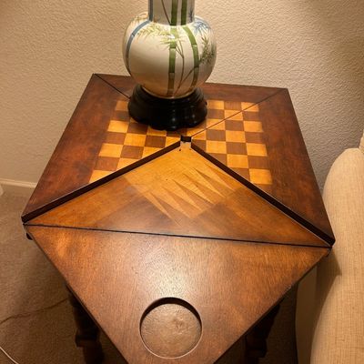 Sale Photo Thumbnail #90: Vintage conversion game table with inlaid wood top featuring chessboard and backgammon patterns, topped with a ceramic bamboo-motive table lamp.