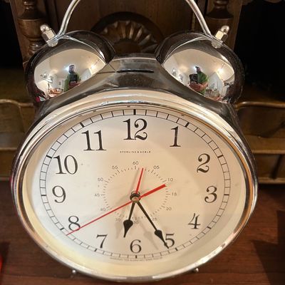 Sale Photo Thumbnail #52: Sterling & Noble oversized chrome twin-bell alarm clock, featuring a white face with black numerals and red second hands.