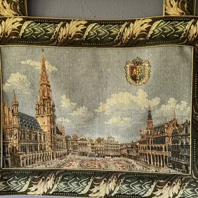 Sale Photo Thumbnail #36: Woven jacquard wall tapestry depicting the Grand Place in Brussels, featuring a leaf pattern border and hanging tabs on a brass rod.