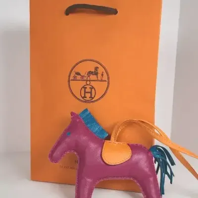 Authentic Hermès Rodeo Horse Bag Charm — Magenta, Teal & Orange with Shopping Bag