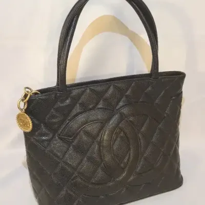 Authentic Chanel Quilted Black Leather Handbag With Large Logo