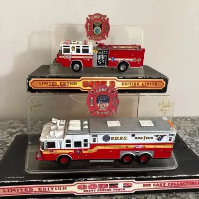 Two “Code Three Collectibles” Fire Trucks 