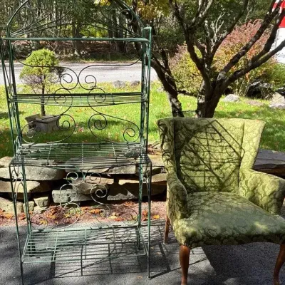 Green Armchair And Metal Shelf