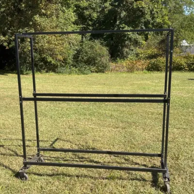 Sale Photo Thumbnail #111: Black metal rolling clothing rack