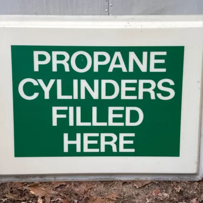Sale Photo Thumbnail #34:  advertising sign 'Propane Cylinders Filled Here'.