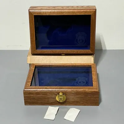 Sale Photo Thumbnail #141: Wooden display case with blue velvet lining.