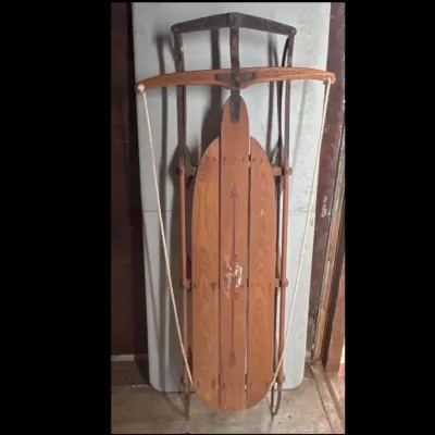 Sale Photo Thumbnail #122: Vintage Flexible Flyer wooden sled with steering bar and pull rope.