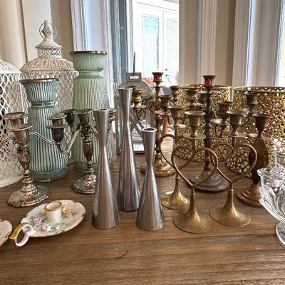 Candlesticks, 2 sets candelabra, lanterns, lots of votives not shown