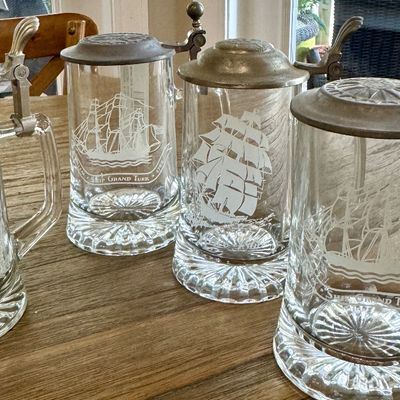 Clipper ships and deer etched glass tankards.  I believe they are Avon collectibles but they are nice!