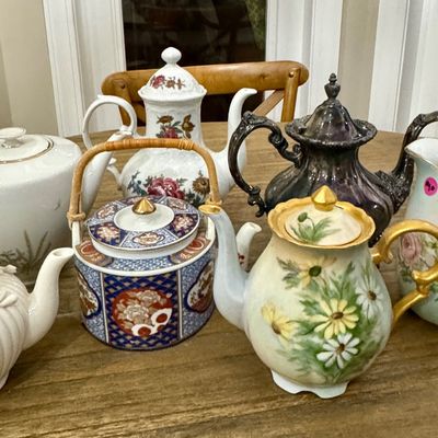 Teapots & coffee pots.  The silver-plate teapot is quite nice and will polish up well.  I just don't have time to do it before...