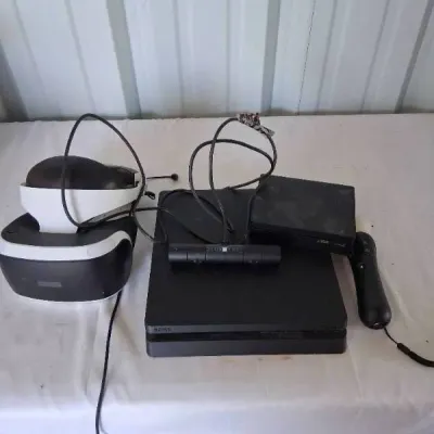 Sony PlayStation 4 Slim console bundle including a PS VR headset, PlayStation Camera, processing unit, and a PlayStation Move motion...