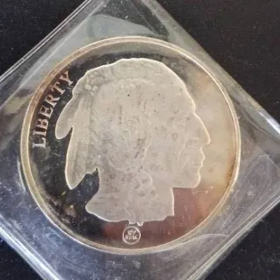One troy ounce silver round featuring the classic Indian Head Buffalo nickel design, encased in a clear protective flip.