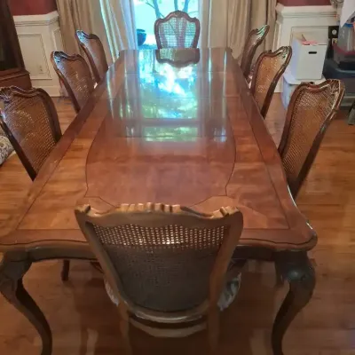 Traditional Carved Wood Extension Dining Table with Cane Back Chairs
