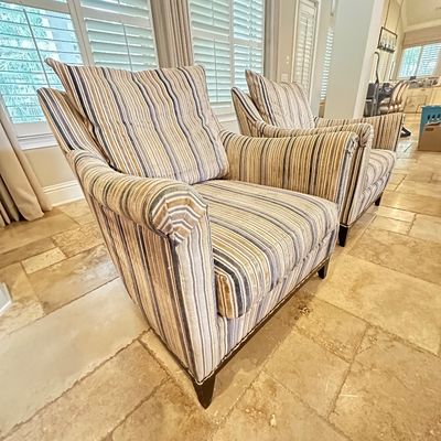 Sale Photo Thumbnail #15: Pair of contemporary upholstered armchairs featuring multi-color vertical stripes, rolled arms, and dark wood legs.