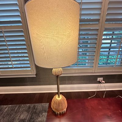 Sale Photo Thumbnail #56: Modern woven wicker and metal table lamp featuring a round wicker base, matching accent orb, and a large beige drum shade.