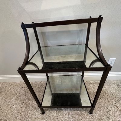 Sale Photo Thumbnail #64: Modern dark bronze metal accent table featuring three levels with glass inserts and curved upper side panels.