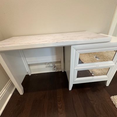 Sale Photo Thumbnail #79: Modern white vanity or writing desk featuring faux-marble top and a two-drawer base with mirrored fronts and crystal-style knobs.
